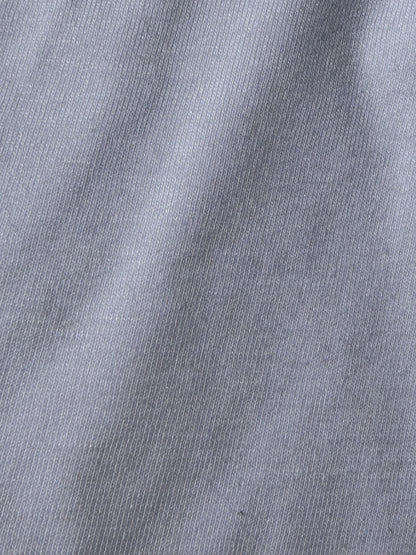 Close-up of the soft jersey-knit surface of a waterproof mattress protector